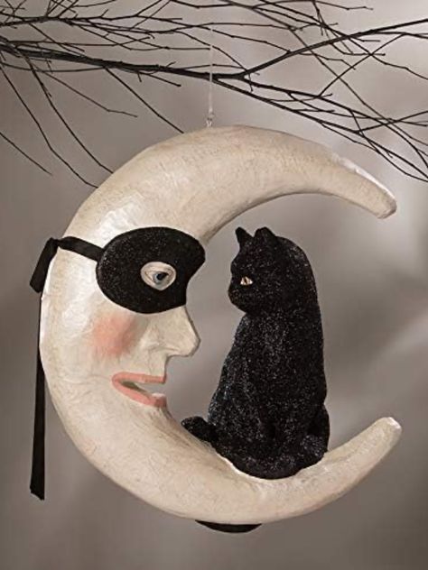 I love this design because it reminds me of old fashioned, vintage style Halloween decor. Made of hand painted paper mache, the crescent moon has a mask with a real ribbon tied around back. Measures 15.5 by 14.5 inches. Bethany Lowe Designs. Mascara Papel Mache, Cat On Moon, Black Cat Sitting, Olive And Cocoa, Bethany Lowe Halloween, Autumn Celebration, Paper Mache Pumpkins, Victorian Halloween, Paper Mache Mask