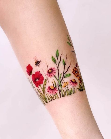 Tattoo Flower Bracelet Wrist, Womens Wrist Tattoos Ideas Beautiful, Wildflower Cuff Tattoo, Birth Flower Arm Band Tattoo, Garden Lover Tattoo, Wildflower Bracelet Tattoo, Wildflower Band Tattoo, Bracelet Tattoo Flower, Flower Garden Tattoo Ideas