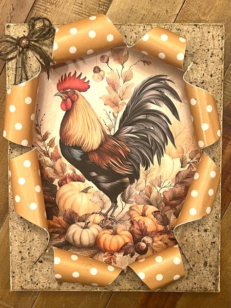 This is an 8 x 10" x 1" deep busted  fall canvas with rooster and pumpkin patch rice paper inside, decoupaged onto a canvas board. The front of canvas is decoupaged with mulberry paper on top and polkadotted brown and ivory scrapbook paper on the inside of canvas cut and rolled up to expose the rooster and pumpkins inside. The scrapbook paper is rolled outward and hot glued with gorilla glue. The mulberry paper on the front of canvas is aged with oak stain distress oxide, and also aged around th Busted Canvas Ideas, Busted Canvas Crafts Diy, Broken Canvas, Burlap Canvas Art, Fall Picture Frame, Rooster Craft, Busted Canvas, Country Gal, Burlap Canvas