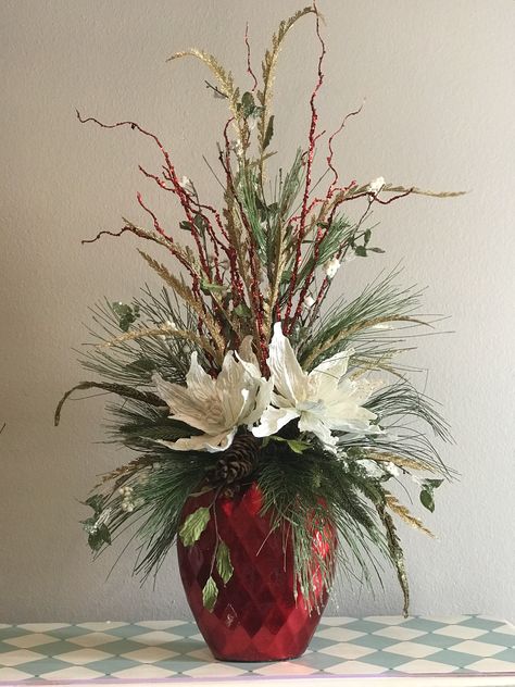 This is centerpiece pretty enough to brighten any corner of your home Christmas Floral Arrangements Diy, Winter Flower Arrangements, Dekoratívne Vence, Winter Floral Arrangements, Winter Arrangements, Winter Planter, Christmas Flower Arrangements, Christmas Planters, Church Flower Arrangements