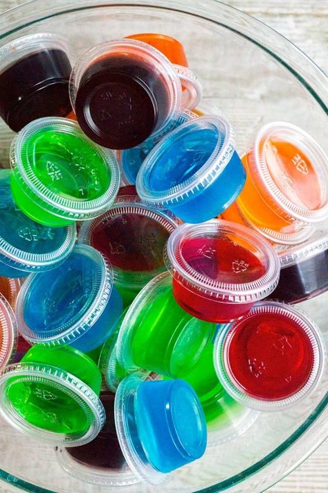 Vodka Jello Shots are a classic #party #cocktail that's easy to whip up and can be made in any flavor of #Jello you love! Be sure to make a bunch, they go fast! #BreadBoozeBacon #vodka #shots #gelatin #gameday #newyearseve Easy Fruity Cocktails, Vodka Jello Shots, Black Cherry Jello, Rum Jello Shots, Easy Jello Shots, Margarita Jello Shots, Making Jello Shots, Best Jello Shots, How To Make Vodka