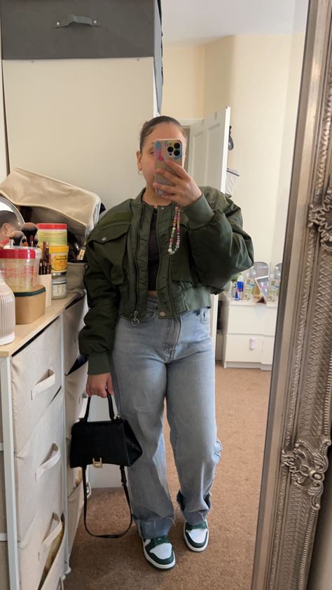 Blue mom jeans, army jacket, zara jacket, balenciaga bag, hourglass bag, balenciaga, zara, crop top, grey crop top, nike dunks, dunk trainers, green nike dunks, mom jeans, blue jeans, slick bun, hairstyle, outfit inspo, outfit, casual Dunks With Jeans Outfit, Grey Dunks Outfit, Dunk Outfit, Mom Jeans Outfit, Blue Jean Outfits, Famous Fashion, Grey Top, Style Change, Blue Outfit