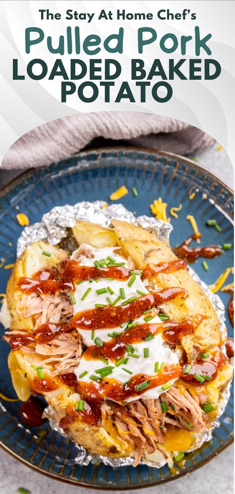 An overhead view of a baked potato on a plate that is stuffed with pulled pork and topped with sour cream and bbq sauce. Bbq Pork Loaded Baked Potatoes, Pulled Pork Baked Potatoes, Pulled Pork And Potatoes, Pulled Pork Baked Potato, Pulled Pork Potato, Smashed Potatoes Baked, Chipotle Pulled Pork, Homemade Nacho Cheese Sauce, Loaded Potatoes