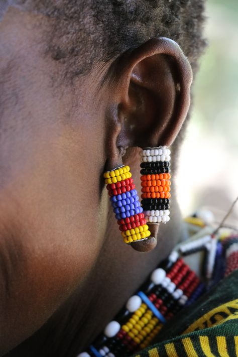 Traditional African earring on a Maasai woman in Kenya. Masai Jewelry, African Wall Art, Sunglasses Strap, Fair Trade Jewelry, Indie Style, African Earrings, Handmade Fair, Maasai, Indie Fashion