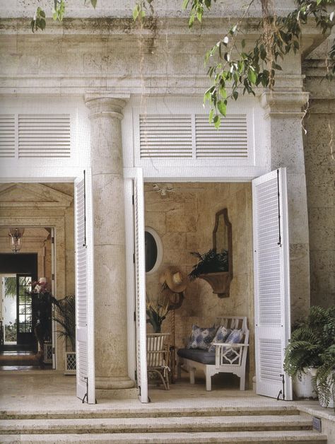 Imagine how cold and uninviting this wold be if it had been done in marble. The travertine used here gives the space warmth and instant rustification. Shutters Repurposed Decor, Farmhouse Shutters, Rustic Shutters, British Colonial Decor, British Colonial Style, Ivy House, Colonial Decor, White French, French Doors Interior