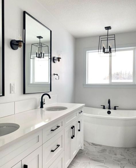 Whether you're revamping your real-life space or adding a touch of luxury to your virtual world, these ideas are sure to make a statement. #BathroomIdeas #BlackAndWhiteDecor #SmallBathrooms #BloxburgBuilds #MonochromeDesign #HalfBathInspo #ChicInteriors #HomeDecor #InteriorDesign #SpaceSavingIdeasHome Powder Room White Vanity Black Hardware, Masculine White Bathroom, White And Black Bathroom Ideas Modern, Black White Gray Master Bath, White Grey And Black Bathroom, White Bathroom Black Accents, Greyscale Bathroom, Modern Bathroom Design Black And White, White Bathroom Black Fixtures