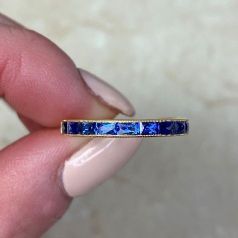 This gorgeous half-eternity band is crafted in 18k yellow gold, featuring elongated French-cut sapphires with a combined weight of 0.84 carats. The channel setting is adorned with delicate milgrain along its edges, and the band measures 2.7mm in width. ✦ GEMSTONE SPECIFICATIONS:  Center Stone: Sapphire  Sapphire Cut: French Cut ✦ WEDDING BAND SPECIFICATIONS: Material: 18K Yellow Gold Stones: Sapphire Band Width: Approx  2.6mm in Width ✦ WHAT COMES IN YOUR SHIPMENT: - Your Wedding Band - Quality Sapphire Wedding Ring Set, Eternity Band Set, Sapphire Eternity Band, Estate Diamond Jewelry, Sapphire Eternity Ring, Wedding Band Styles, Sapphire Wedding Band, Channel Setting, Sapphire Band