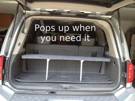 SUV pop-up shelf for the cargo area.  Folds down when not in use, can hide valuables under, and segregate items when needed. Trunk Shelf, Suv Trunk Organization, Suv Storage, Layering Carpet, Family Suv, Car Trunk Organization, Trunk Organization, Car Hacks, Car Trunk