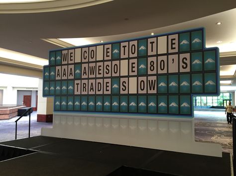 This game show board was an awesome outside-the-box addition to AAA's 80's themed trade show! Board Game Center Piece, Board Game Prom, Board Game Backdrop, Game Show Themed Party Ideas, The Game Of Life Decorations, Game Show Party Ideas Decorations, Game Show Party Decorations, Game Show Theme Party, Gameshow Set Design