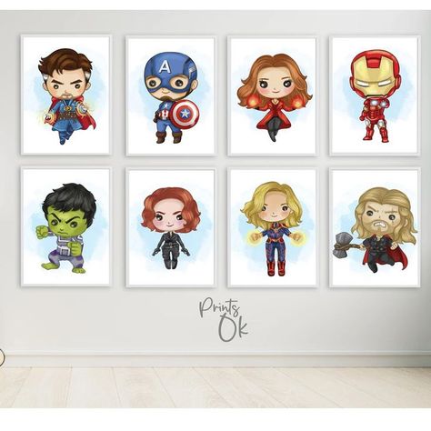 Six wooden framed pictures on a beige wall. Each frame features an illustration from the Avengers as kids including Dr. Strange, Captain America with his shield, Scarlet Witch with her hands glowing, Ironman with his hand out raised to fire, Hulk, Black Widow sporting her guns, Captain Marvel with glowing hands, and Thor looking angry with his hammer. Marvel Theme Nursery, Nursery Ideas Superhero, Marvel Themed Nursery, Marvel Nursery Ideas, Marvel Toddler Room, Avengers Kids Room, Marvel Female Superheroes, Avengers Printable, Avengers Nursery