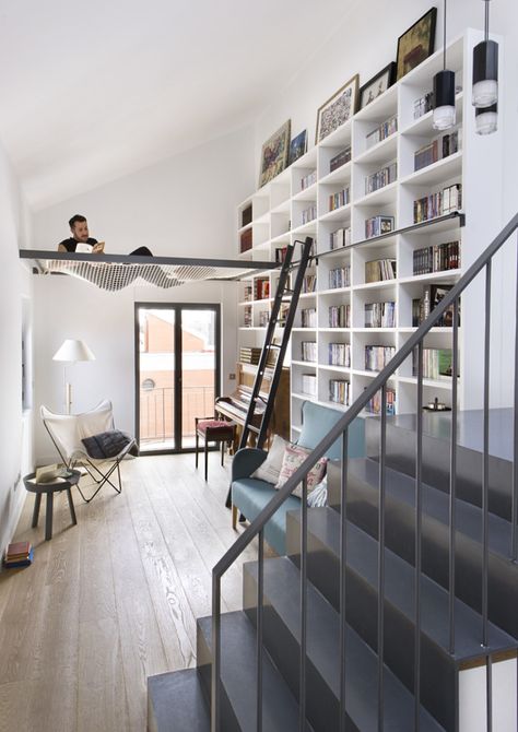 Book Lover’s Dream: Hammock Reading Nook in Home Library In Home Library, Floor To Ceiling Bookshelves, Madrid Apartment, Indoor Hammock, Loft Interior, Home Library Design, Home Libraries, Apartment Inspiration, Home Library