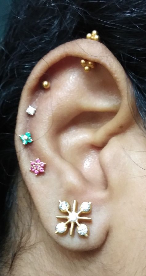 Jus tried with few tamil traditional multiple ear piercings😍 Ear Piercing On Top Of Ear, Ear Second Tops Gold, Second Tops Earrings Gold Indian, Ear Piercing Ideas Indian Style, Traditional Indian Ear Piercing, Gold Bugadi Earrings, Side Tops Earrings Gold, Bugadi Ear Piercing, Indian Piercing Ear