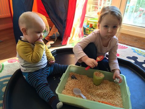 Last week I set up some edible sensory play for babies by dumping a load of Rice Kripies that had just gone out of a date into a tray and placing the tray in our tuff spot (to try and contain some of the mess).    Cereal makes a great sensory play... Sensory Activities For 1 Year, Edible Sensory Play, Sensory Play For Babies, Edible Sensory, Sensory Tray, Tuff Tray Ideas, Tuff Spot, Sensory Bags, Creative Development