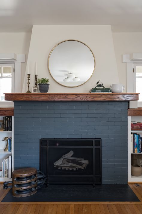 Painted brick fireplace Dark Blue Brick Fireplace, Navy Fireplace Brick, Navy Blue Brick Fireplace, Tudor Revival Fireplace, Fireplace Colors Painted, Green Painted Fireplace, Painted Brick Chimney, Blue Painted Fireplace, Navy Blue Fireplace