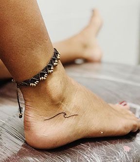 Ankle Wave Tattoos For Women, Life Comes In Waves Tattoo, Pura Vida Wave Tattoo, Wave Ankle Tattoos For Women, Cute Wave Tattoos, Foot Tattoo Placement Ideas, Small Wave Tattoo Ankle, Wave Tattoo On Ankle, Dainty Wave Tattoo