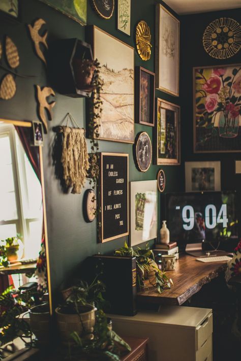 Bohemian Jungle Office Inspiration | vaughan-house.com Cluttercore Office, Jungle Theme Bathroom Ideas Master Bedrooms, Hipster Office Decor, Dark Wall Aesthetic Bedroom, Cozy Art Room Ideas, Slytherin Living Room Ideas, Hiker Home Decor, Moody Eclectic Office, Green Room With Gold Accents