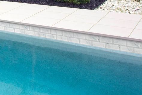 There are many things to consider in designing or refurbishing the perfect pool such as determining a shape and size, water features and decorations. One of the most important (and overlooked) elements, is pool waterline tile. Waterline tile is the perfect way to give your pool an extra design jolt. The water in your pool will appear extra shiny and luminous when the sun reflects off the surface of the tile. Additionally, you can use waterline tile to add a pop of color to your pool. Glass is an Pool Waterline Tile Ideas Modern, Pool Tile Waterline Modern, Waterline Tile For Pool, Simple Waterline Pool Tile, Pool Tile Waterline, Arizona Pool Designs, White Pool Tile, White Waterline Tile Pool, Pool Tile And Coping