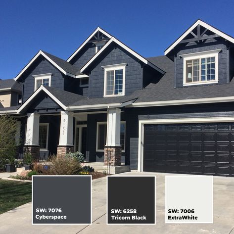 Here is a black and dark blue house color scheme that will get your house some need attention.  Amazing exterior color schemes.  For more color ideas visit our Instagram page:  https://www.instagram.com/idahopainter/ Navy And Black House Exterior, Charcoal Blue Exterior House, Blue House Black Trim, Grey Blue Exterior House Colors, Blue Brick House Exterior, Navy Blue House Exterior, Modern Black Houses, Painting A House, Dark Blue House