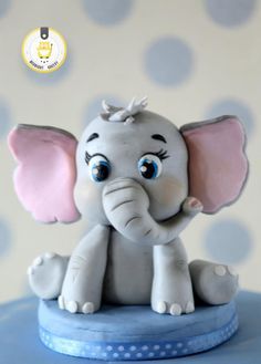 A welcome back cake made for a little boy who was visiting his grand parents for holidays. His current love is ele, animals and the colour blue. Hence came up with this design! Just loved working on this one. Torturi Baby Shower, Dumbo Cake, Fondant Elephant, Elephant Cake Toppers, Elephant Cakes, Baby Elefant, Cake Topper Tutorial, Fondant Animals, Fondant Cake Toppers