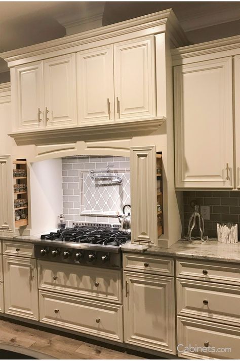 This traditional kitchen’s hearth hood and spice pullouts offer both convenience and style. Kitchen Island Storage Ideas, Ivory Kitchen Cabinets, Vanilla Kitchen, Granite Kitchen Countertops, Ivory Kitchen, Traditional Kitchen Cabinets, Beige Backsplash, Kitchen Cabinets Ideas, Order Kitchen