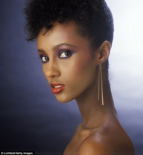 Early start: The former catwalk queen stunned with a seductive expression during a photo shoot in 1980 Iman Bowie, Iman Model, Iman Abdulmajid, Supermodel Iman, Black Supermodels, Black Glamour, 80's Fashion, Purple Makeup, Women Models