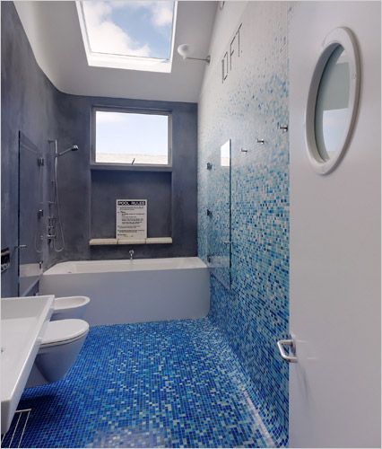 a modern San Fran home where the bathroom is made to look like a swimming pool.  There's a depth marking on the wall, blue tiles, and a beautiful skylight! Kind of a neat idea.  This was designed for a "skateboarder's nirvana" but this would be neat for swimmers, too.  However, the tile all over the bathroom may be a hard resale issue. Blue Bathroom Paint, Light Blue Bathroom, Small Bathroom Paint, Bathroom Tile Inspiration, Blue Bathroom Accessories, Creative Bathroom, Bathroom Paint Colors, Brown Bathroom, White Bedroom Furniture