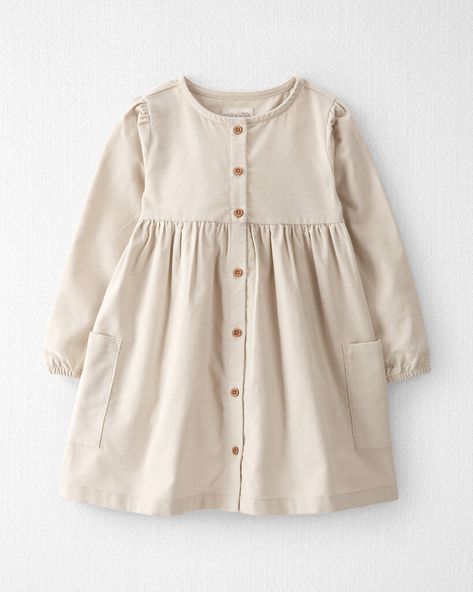 Here's another take on our super soft corduroy. Featuring a long sleeve design and certified organic cotton, you can dress up your little one in a look that's made for fall days and the sweetest memories. Crafted in the purest organic fabrics and sustainable materials, Little Planet is a return to simplicity. Thoughtful essentials and timeless pieces to gift or to hold on to. Parent Dr, Girls Frocks, Planet Clothing, Mini Outfit, Long Sleeve Ruffle Dress, Cozy Dress, Button Front Dress, Corduroy Dress, Photoshoot Outfits