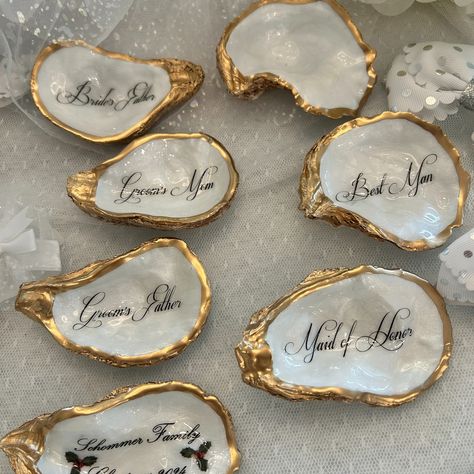 Oyster Shell Place Cards, Wedding Place Cards, Oyster Place Cards, Oyster Wedding Favor, Wedding Place cards, Wedding Decor, Pearl Wedding Handmade gifts for all of life’s special occasions. Shop on our Etsy link below https://www.etsy.com/shop/tidesoftimedesigns Custom Oyster Shell Mother of The Bride with Wedding Date - Thoughtful Gift for the Moms - Mother of the Groom - Step Mom, bridesmaids, bridal party, wedding rehearsal dinner guests, and more. ❤️Thank you for looking and hope we... Shell Name Places, Oyster Place Cards Weddings, Oyster Themed Party, Oyster Wedding Decor, Oyster Name Cards, Oyster Shell Place Cards, Oyster Wedding, Shell Place Cards, Place Value Cards