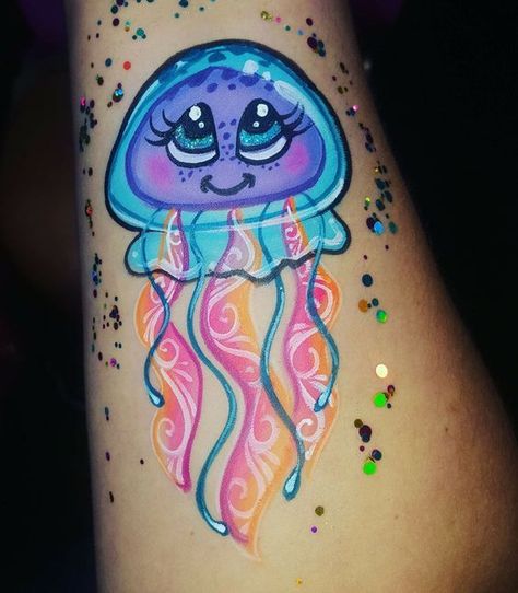 Discover the art of transformation with jellyfish tattoos in our article. Explore it and find 50+ stylish designs with meanings explained. Jellyfish Face Painting, Jelly Fish Face Painting, Jellyfish Face Paint, Kawaii Face Paint, Easy Body Painting, Fish Kawaii, Mermaid Face Paint, Animal Face Paintings, Bodysuit Tattoos