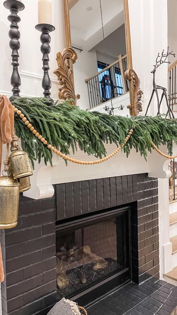 Emily | Interior Design & E-design on Instagram: "Part 2 of the Christmas Mantle. This garland was so popular that it has sold out but I’ll be link alternatives in my bio. All supplies and measurements are in the final part of this reel so you can save for later Have you started decorating for Christmas yet? #christmas2022 #fireplacemantle #christmasfireplacedecor #christmasmantle #seasonaldecor #garland #fairylights #woodgarland" Bells On Mantle, Modern Mantle, Electric Fireplace Mantle, Decorating For Christmas, Christmas Fireplace Decor, Christmas Decor Inspiration, Christmas Mantel, Christmas Mantle, Christmas Mantels