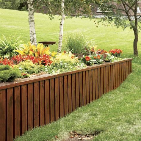 Instead of using stone or timbers, make an attractive, long-lasting retaining wall from pressure-treated 2x4s, plywood and trim boards. Construction is fast Retaining Wall Steps, Retaining Wall Ideas, Wood Retaining Wall, Diy Retaining Wall, Building A Retaining Wall, Garden Retaining Wall, Backyard Swings, Landscaping Retaining Walls, Building A Pergola