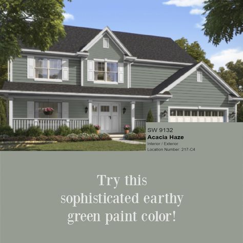 Acacia Haze 9132 SW paint color is an earthy green shown here on a house exterior - Hello Lovely. #acaciahaze #greenpaint Acacia Haze Sherwin Williams Exterior House, Best Green House Colors, Acacia Haze Exterior House, Sherwin Williams Acacia Haze Exterior, Sw Acacia Haze Exterior, Acacia Haze Exterior, Grey Green House Exterior, Acacia Haze Sherwin Williams Exterior, Green Painted House Exterior