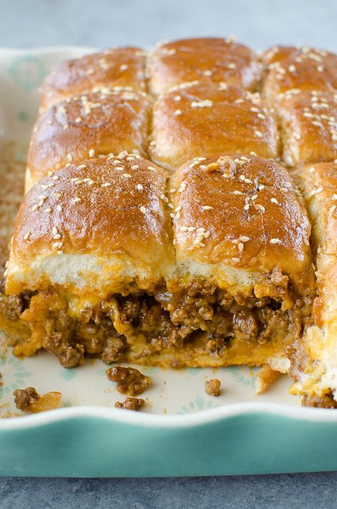 Sloppy Joe Sliders - an easy way to serve sloppy joes to a crowd! Sloppy joe meat and cheese on Hawaiian rolls and covered in the most delicious glaze. Great for a weeknight dinner, a party, or tailgating! Sloppy Joe Sliders Hawaiian Rolls, Sloppy Joes Homemade, Crockpot Sloppy Joes, Sliders Hawaiian Rolls, Cheeseburger Sloppy Joes, Sloppy Joe Sliders, Halloween Apartment, Sliders Recipes Hawaiian Rolls, Sloppy Joes Sliders