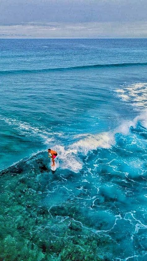 surfer riding the blue ocean Maldives Surfing, Surfing In Australia, Maldives Culture, Surfing In Bali, Tropical T-shirt For Surfing During Beach Season, Surfer Look, Liveaboard Boats, Best Surfing Spots, Offshore Wind