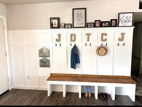 Entryway board and batten wall and built-in bench. Bench made with 2x12s (primarily), and the board and batten wall was made with 1x’s. Letters and metal envelopes were purchased at Hobby Lobby (paper mache letters are so much cheaper than the metal ones, and turned out to be a great match with our bench!). Board And Batten Wall With Built In Bench, Half Wall Mudroom Entry Ways, Board And Batten Drop Zone, Board And Batten Backpack Wall, Mud Room Board And Batten, Board And Batten Wall With Bench, Board And Batten With Bench, Board And Batten Mudroom Wall With Bench, Board And Batten Entryway With Shoe Storage