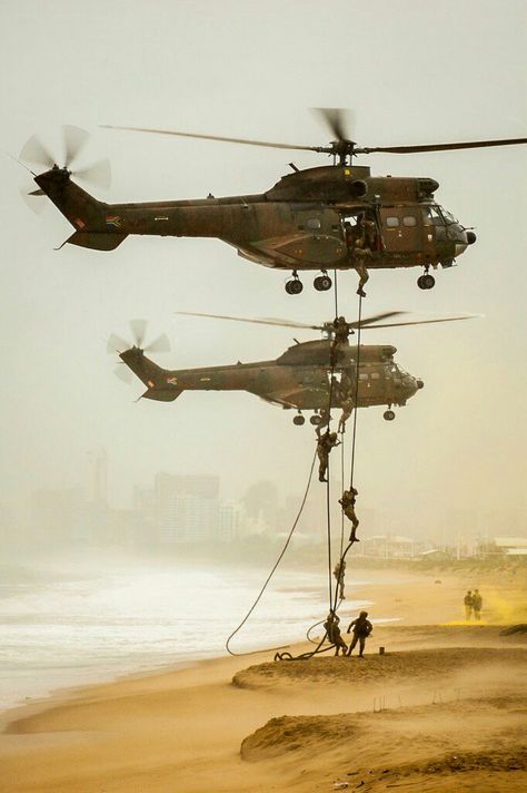 Oryx helicopters rappelling troops during a mock beach assault at Armed Forces Day '17. South African Air Force, Armed Forces Day, Military Aesthetic, Military Soldier, Army Images, Military Wallpaper, Military Artwork, Military Insignia, Royal Marines