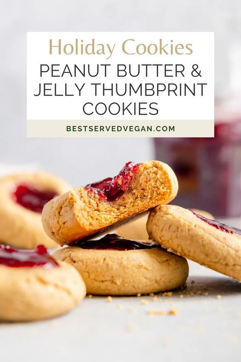 This is an easy recipe for Peanut Butter and Jelly Vegan Thumbprint Cookies made with oat flour! These sweet & salty gluten-free peanut butter & jelly bites are are made with 6 ingredients. They're easy and delicious, and should be a favorite for holiday cookie plates. This quick and easy recipe for vegan peanut butter and jelly cookies ticks all my boxes: it’s made in under 30 minutes, has a perfect balance of sweet and salty flavors, and is easy to customize with different flavors! Jelly Thumbprint Cookies, Vegan Thumbprint Cookies, Peanut Butter And Jelly Cookies, Peanut Butter Thumbprint Cookies, Vegan Holiday Cookies, Easy Vegan Cookies, Vegan Shepherds Pie, Vegan Peanut Butter Cookies, Jelly Cookies