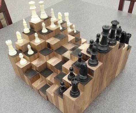 A multiple level 3D chess board. Made of walnut, each block is at a different height to add a fun and artistic factor to the classic game of chess. With a proper workshop and a few pieces of walnut lumber, you can build your own 3D chess board in less than a week. This craft is both appealing to the eye and also a great way to test your skills of chess in a whole different way. 3d Chess Board, Kids Woodworking Projects, 3d Chess, Woodworking Projects For Kids, Woodworking For Kids, Got Wood, Diy Workshop, Diy Holz, Wooden Chess