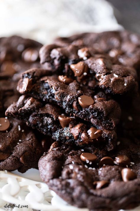 Bake these chewy Double Chocolate Chip Cookies made with dutch processed cocoa powder. They’re soft in the centers with buttery edges and they’re filled with chocolate chips and sea salt. You can make them with white chocolate chips too! Cocoa Chocolate Chip Cookies, Double Chocolate Sea Salt Cookies, Choc Choc Chip Cookies, Fudgy Double Chocolate Chip Cookies, Chocolate Chip Chocolate Cookies, Easy Double Chocolate Chip Cookies, Oatmeal Chocolate Chunk Cookie Recipe, Chocolate Dipped Chocolate Chip Cookies, Domino Cookies Great American Cookie