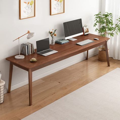 PRICES MAY VARY. MINIMALIST STYLE - This long desk will be an excellent table for you. The whole presents contemporary minimalism, suitable for home office work and study; QUALITY MATERIALS - Manufactured from thicked MDF tabletop and solid wood legs, rounded corners of the table effectively protect your safety; SPACIOUS TABLETOP - Desktop dimensions: 62.99"(W)x19.69"(D)x29.53"(H), with a large office area of 8.61 square feet, double workstation to meet the daily use of the family; FLEXIBLE FUNC Long Desk, Computer Workstation, Office Desks, Desk Table, Office Work, Extra Long, Home Office, Walnut, Mid Century