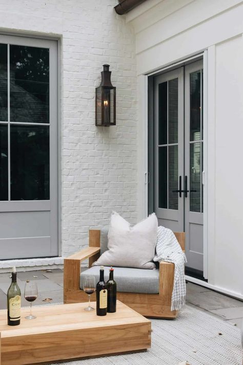 Patio Pizzazz: Small Garden Layouts and Backyard Inspirations White Brick And Siding House, White Brick Gray Trim, Grey Trim Exterior House, Painted Gray Brick House Exterior, Modern White Brick House, Equestrian Kitchen, Painted White Brick House, White Ranch House, White Brick House Exterior