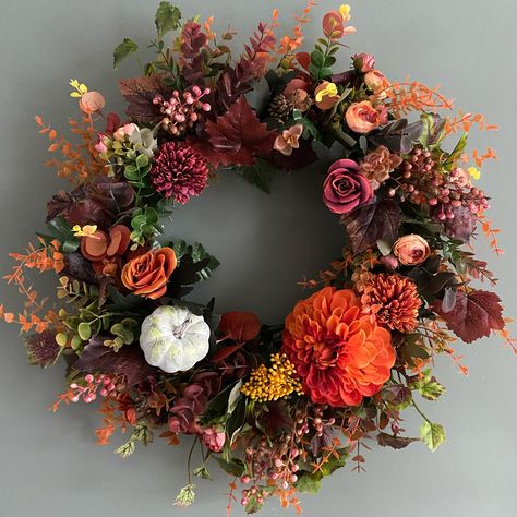 I R I S A combination of autumnal colours including rust, dark berries and greens. Made with plum coloured roses, and one my favourite Autumn flowers, the Dahlia. Accessorised with pumpkins for that seasonal touch. Wreath diameter is approx 55cm. Wreath hooks available separately. Details to order are in comments. #autumnwreath #frontdoorwreath #prettybusyblooms #wreathsofinstagram #artificialautumnwreath #artificialwreath #luxurywreaths #hellopumpkin Coloured Roses, Wreath Hook, Autumnal Colours, Autumn Flowers, Artificial Wreath, Autumn Wreaths, Plum Color, Fall Flowers, Wreaths For Front Door