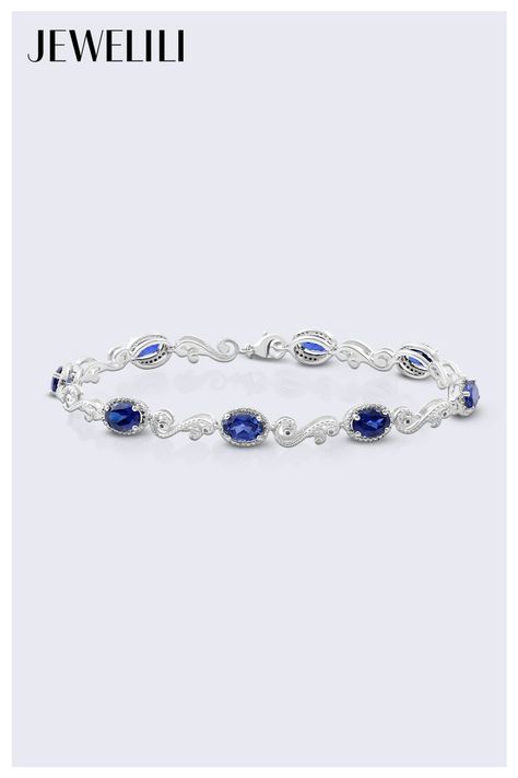 Add a splash of refinement to your wrist with this Sterling Silver 7x5MM Oval Shape Gemstone and Natural White Diamond Accent Link Bracelet. Featuring radiant oval gemstones beautifully linked together and accented with sparkling diamonds, this bracelet exudes timeless sophistication. Perfect for elevating any outfit, it's an eye-catching piece that stands out. Ideal as a thoughtful gift for September birthdays, it celebrates the beauty of the sapphire birthstone in an unforgettable style. Sapphire Birthstone, Sapphire Bracelet, Sparkle Diamonds, White Diamond, Link Bracelets, Oval Shape, Round Diamond, Timeless Pieces, Blue Sapphire