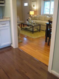 dark brown (no yellow) wood floor: Love how you have the same oak flooring but stained/finished two different colors in different rooms - very striking.  Of course if the floors were being restored we would have to make two different stain colors, one for each room! Hardwood Floor Colors, Floor Stain, Refinishing Hardwood Floors, Yellow Wood, Refinishing Floors, Dark Wood Floors, Oak Flooring, Bamboo Flooring, Floor Colors