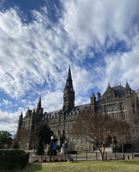 Healy Hall with its distinctive clock tower, shown on a clear day with blue sky and puffy white clouds above Georgetown University Washington Dc, University Washington, Good Morning Usa, College Tour, Digital Vision Board, Georgetown University, Dream School, January 2023, University Campus