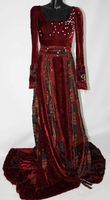 Red pearl dress from "The Secret of Moonacre" as worn by Dakota Blue Richards. Moonacre Dress, Secret Of Moonacre, The Secret Of Moonacre, Red Pearl, Red Velvet Dress, Velvet Gown, Fantasy Dresses, Fantasy Gowns, Medieval Dress