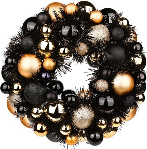 Black Wreath Christmas, Gold Black Christmas Decor, Black And Gold Ornaments, Tv Stand Christmas Decor, Black Christmas Wreath, Black And Gold Christmas Decor, Gold Ornament Wreath, Christmas Ball Wreath, Black And Gold Christmas