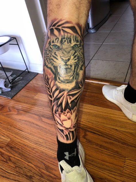 Tiger with jungle leaves and lotus flower Tiger With Leaves Tattoo, Tiger Leg Sleeve Tattoo, Jungle Leg Sleeve, Men Leg Sleeve, Jungle Leaves Tattoo, Tiger Leg Tattoo, Yugioh Tattoo, Tattoo Leg Sleeve, Leg Band Tattoos