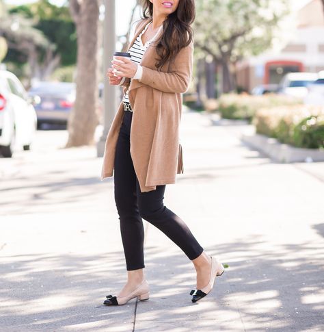 camel drapey cardigan cap toe bow pumps striped sweater petite black jeans Ferragamo Shoes Women Outfits, Cap Toe Heels Outfit, Cap Toe Flats Outfit, Cap Toe Shoes Outfit, Bow Shoes Outfit, Nude Flats Outfit, Trending Casual Outfits, Festive Outfit Ideas, Pumps Outfit