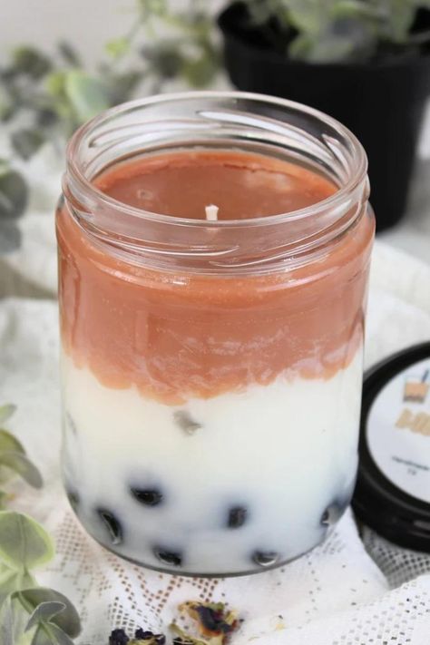 This boba tea candle smells like a delicious milk tea drink with notes of vanilla, cream, and sugar. This unique candle is made completely from wax including the boba bits at the bottom of the candle. This is made to enjoy and burn just like any other candle. The swirled wax gives this boba candle the illusion of milk and tea being mixed inside of the container. This makes for a great gift for boba tea lovers.

-Vanilla, cream, sugar
-50hrs burn time
-Completely made from candle wax Boba Candle, Milk And Tea, Tea Candle, Candle Smells, Unique Candle, Tea Candles, Boba Tea, Tea Lovers, Vanilla Cream